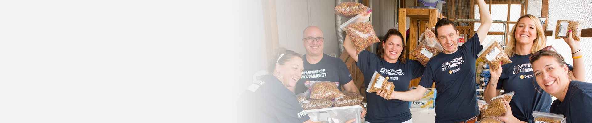 Banfield associate volunteering at a pet food bank event