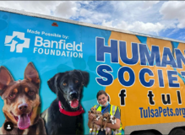 a dog holding a bone